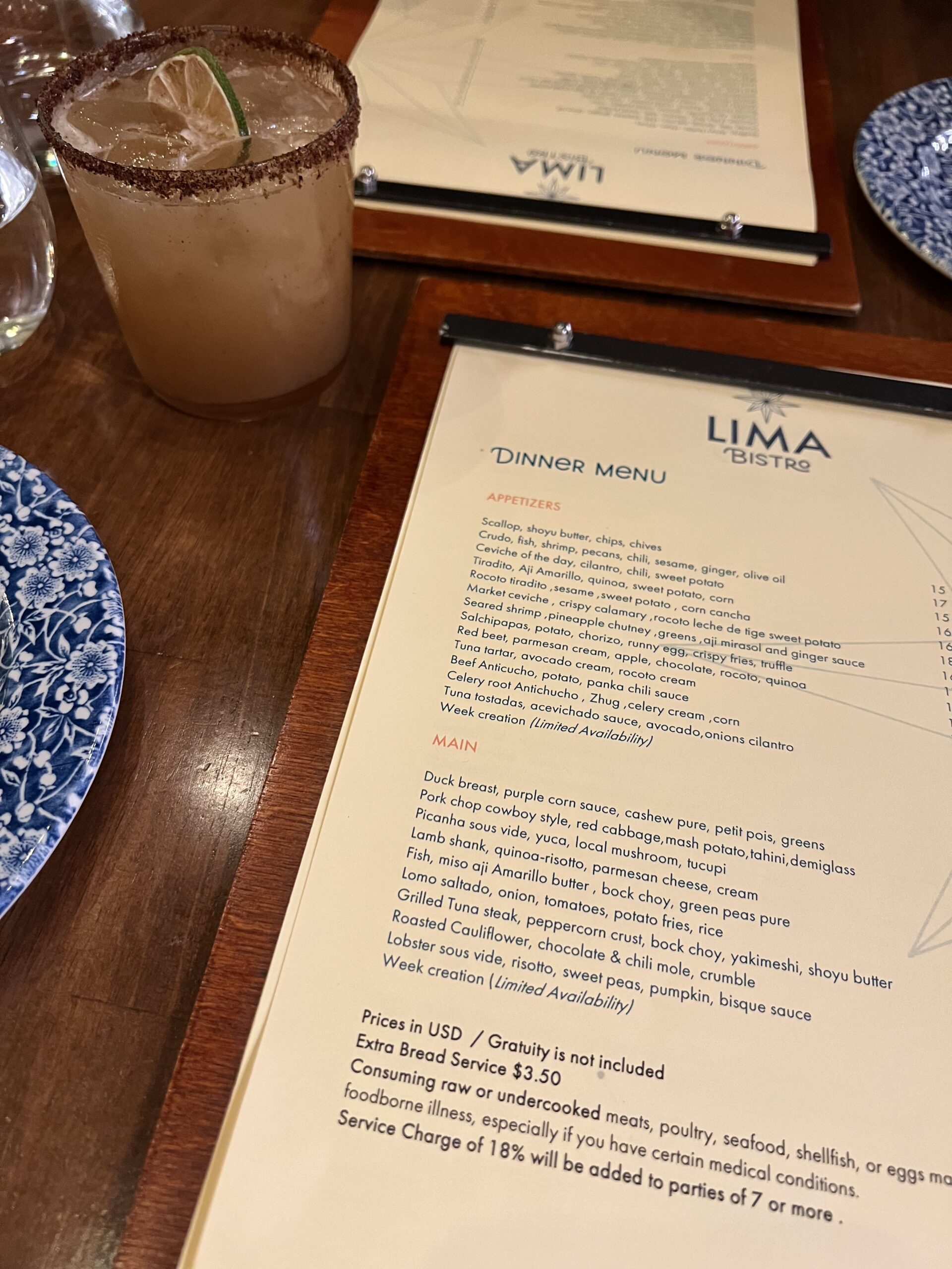 Cocktail and menu at Lima Bistro inside Harbour House Aruba
